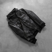 
Gedragen perspectief van Bouncer Biz Black Leather Hooded Bomber Jacket op model - Natuurlijke valling bij daglicht