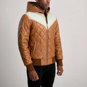 
Gedragen perspectief van Norman Tan Hooded Bomber Leather Puffer Jacket op model - Natuurlijke valling bij daglicht